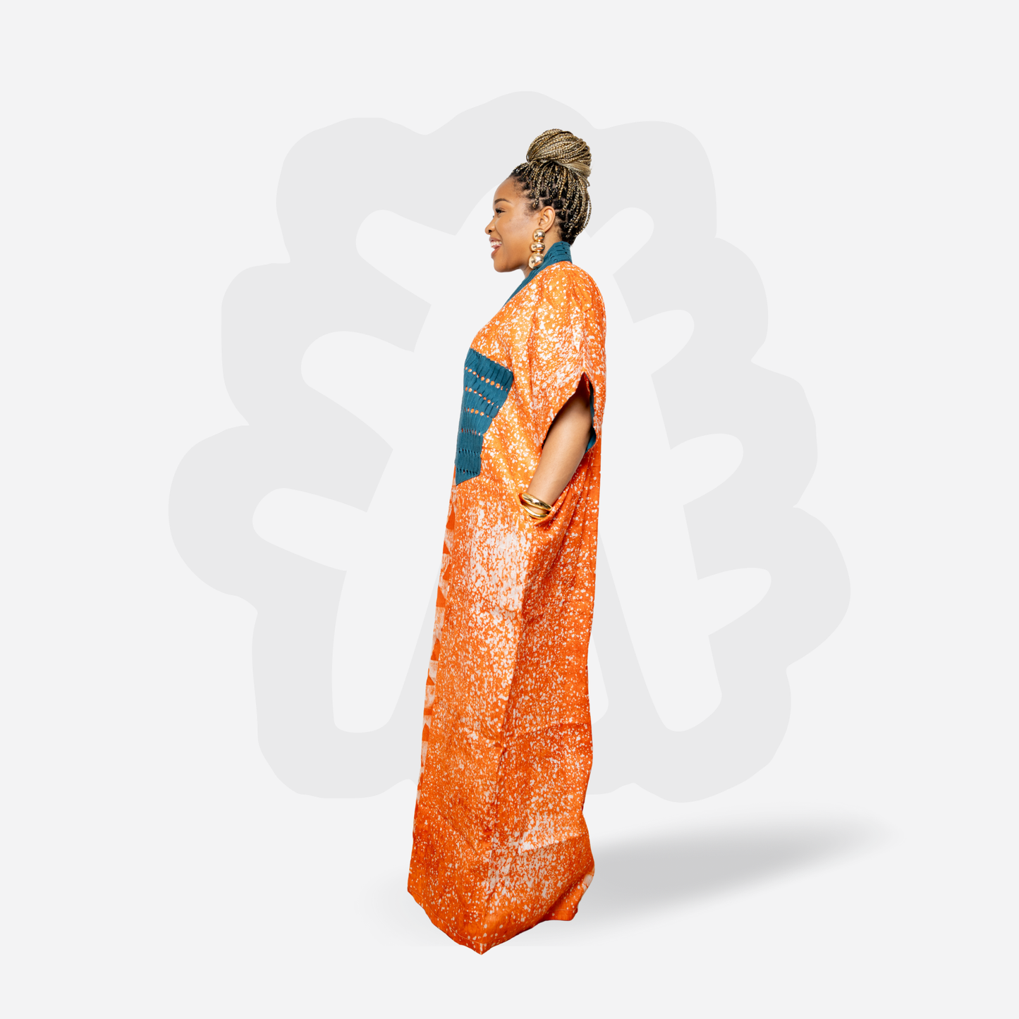 Orange Adire Kaftan Bubu with green hand woven Aso oke neck detail